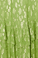 Green Harmony Dress detail highlighting the gold jacquard animal print and ruffled tiers.