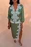 Thumbnail for Green Lace Wrap Midi Skirt with white cascading lace detailing and a side slit, styled with a matching top.
