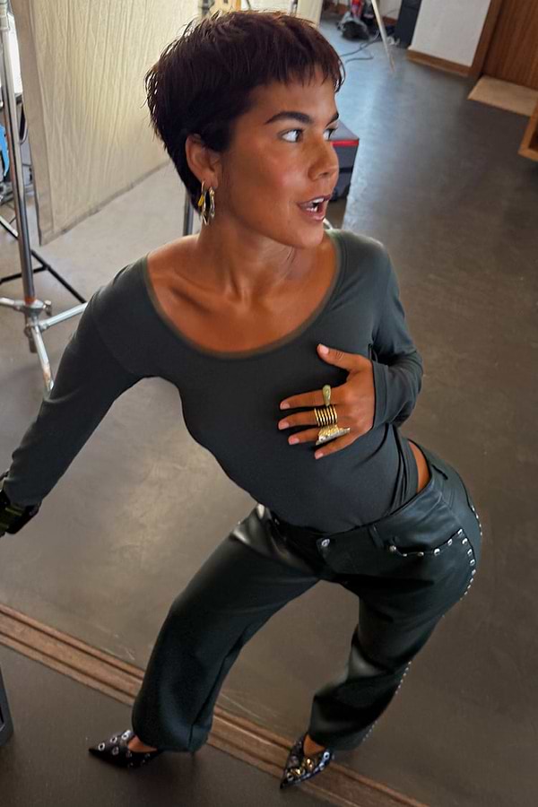 Dark green long sleeve Teddy T-shirt with mesh neckline detail and studded leather trousers.