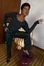 Thumbnail for Green Long Sleeve Teddy T-Shirt with mesh neckline detail, styled with matching leather-look trousers.