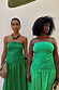 Green Lola Mid-axi Dress with a ruched bodice and multi-wear straps, shown on two models for inclusive sizing.