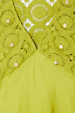 Green Shell Mini Elodie Dress detail featuring lime crochet knit, satin, and gold shell charms.