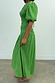 Green Shirred Nara Dress featuring a shirred bodice, puff sleeves and a pleated midaxi skirt.