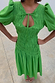 Thumbnail for Green Shirred Nara Dress featuring a multi-wear tie neck, puff sleeves, and an elasticated smocked bodice.