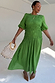 Green Shirred Nara Dress with a shirred bodice and puff sleeves, highlighting inclusive sizing.