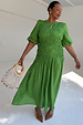 Green Shirred Nara Dress with a shirred bodice and puff sleeves, highlighting inclusive sizing.