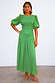 Green Nara Dress with a shirred front, puff sleeves and pleated skirt, an iconic multi-wear midaxi style.