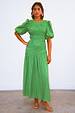 Green Nara Dress with a shirred front, puff sleeves and pleated skirt, an iconic multi-wear midaxi style.