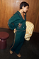 Bottle Green Safari Cardigan with fringe and embroidery, styled as a knitwear co-ord with matching trousers.