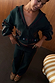 Bottle Green Safari Cardigan with fringe trim and embroidered motifs, paired with matching knit trousers.