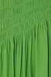 Green Shirred Nara Dress close-up highlighting the elastic shirring and lightweight pleated green fabric.