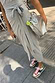 Thumbnail for Grey Jesse Jersey Wrap Dress with a multi-wear tie, styled with colourful trainers and a silver metallic bag.