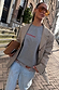 Grey Check Blazer layered over a grey sweatshirt and lace-trimmed denim for a London look.