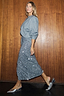Thumbnail for Gunmetal Sequin Jaspre Midi Skirt paired with a grey sweatshirt and silver pointed-toe heels.