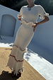 Ivory and Red Harper Dress in cream crochet knit with tassel detailing and red bead accents.