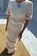 Thumbnail for Ivory and Red Harper Dress featuring crochet scallop bands, tassels and red bead accents on a cream knit mid-axi.