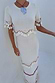 Ivory and Red Harper Dress in cream knit with scallop crochet and red bead tassel detailing.