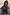 Thumbnail for Hexagon Orange Sunglasses with light-tinted lenses, worn with a patterned knit cardigan for a vacation look.