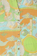 Isla Miley Shirt detail showcasing the hand-painted Isla print with fish and citrus motifs in soft pastel tones.