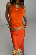 Hot Coral Ribbed Tank in soft stretch fabric, styled with a colourful patterned maxi skirt.