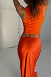 Hot Coral Ribbed Tank in vibrant orange ribbed fabric, shown from behind on a 5ft7” model wearing a UK 10/US 6.