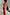 Thumbnail for Hot Coral Ribbed Tank in orange ribbed fabric, shown from the back during a behind-the-scenes photoshoot.
