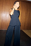 Black Hotfix Sol Waistcoat with diamond embellishments, styled as a co-ord with matching wide-leg trousers.