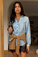 Ice Blue Miley Shirt with blouson sleeves and tortoise buttons, paired with leopard print lace-trimmed shorts.