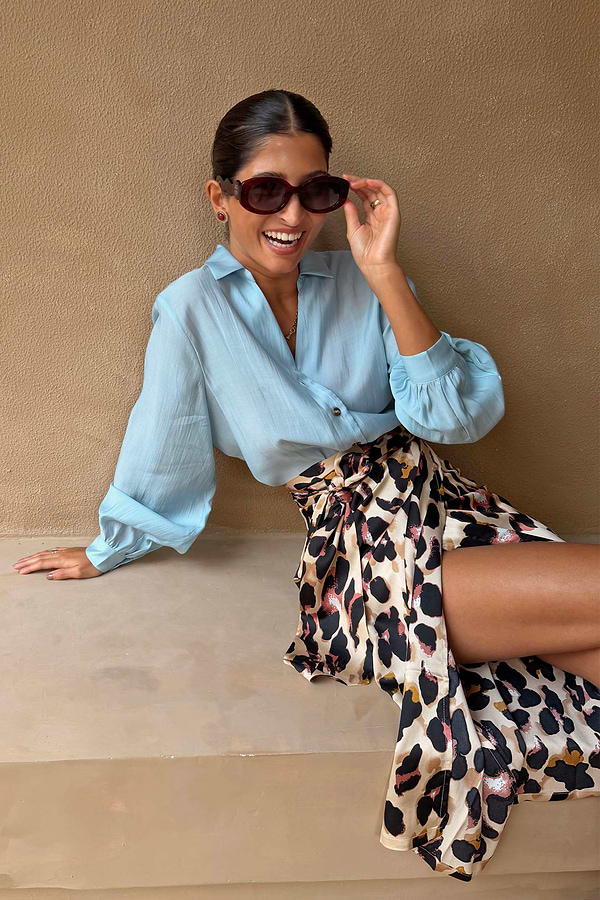 Ice Blue Miley Shirt with blouson sleeves styled with a leopard print wrap skirt.