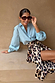 Ice Blue Miley Shirt with blouson sleeves styled with a leopard print wrap skirt.