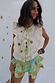 Cream cotton-linen Isla Tia Top with green tie-front fastenings, ruffle lace trim and iconic NFD motifs.