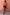 Thumbnail for Tan Jaden Floral Maeva Mini Skirt with burnt orange lace trim, styled with an orange tank top.