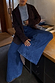 Blue Denim Pallazzo Jan Jean with a wide-leg silhouette, styled with a brown blazer and leopard print belt.