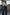 Thumbnail for Blue Denim Pallazzo Jan Jean with a voluminous wide-leg fit, styled with a silver cardigan for an effortless London look.