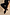 Thumbnail for Black Night Garden Knit Jogger featuring pink blanket stitch detailing and wide legs, styled with leopard print trainers.