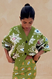 Khaki Eye Cardigan with iconic eye and heart motifs, styled as a co-ord with a matching printed skirt.