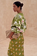 Khaki Eye Dorris Skirt and matching cardigan featuring green and pink heart and eye motifs, designed in-house in London.