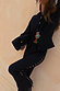 Black Studded Knit Trousers featuring silver metal studs down the leg, styled as a soft knitwear co-ord.