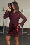 Burgundy lace shirt with flared cuffs and matching sequin mini skirt, shown in a mirror selfie.