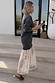 Grey Knit Jumper Dress with a sheer white lace skirt, styled for a casual street style look.
