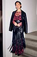Black Leather Blazer draped over a cherry-print dress and fringed bag for a multi-wear transeasonal look.