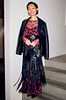 Black Leather Blazer draped over a cherry-print dress and fringed bag for a multi-wear transeasonal look.