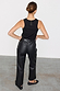 Back view of high-waisted Black Vegan Leather Trousers with a straight leg, paired with a black ribbed tank top.