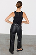 Back view of high-waisted Black Vegan Leather Trousers with a straight leg, paired with a black ribbed tank top.