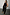 Thumbnail for Black vegan leather trousers with a straight leg, styled with a black tank top and gold heels.