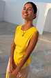Yellow Lace Insert Top with intricate lace detailing at the neckline and hem, styled with a pink patterned skirt.