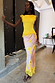Yellow Lace Insert Top with an asymmetric lace hem and trim, styled with a pink floral skirt.