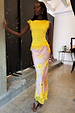 Yellow Lace Insert Top with an asymmetric lace hem and trim, styled with a pink floral skirt.