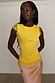 Yellow Lace Insert Top with an asymmetric hem and intricate lace detailing on the sleeves and neckline.