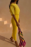 Yellow Sunshine Tilly Dress in plissé with gold flecks, an off-the-shoulder neckline and lettuce hem.